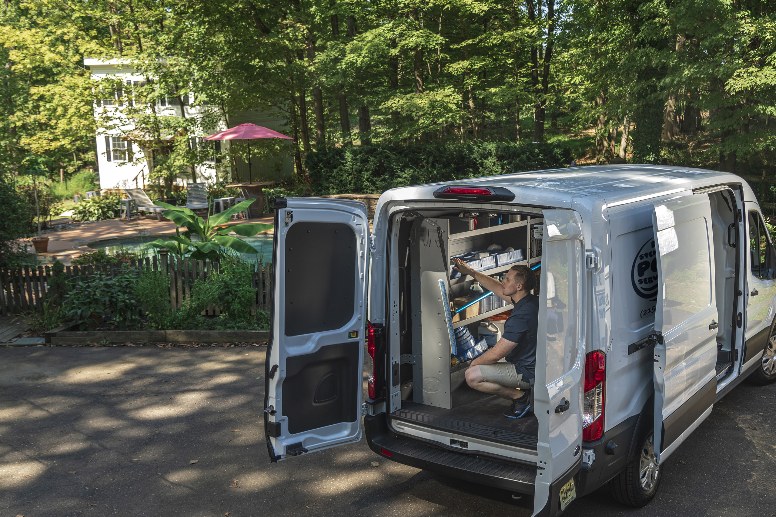 a man sitting in the back of a van