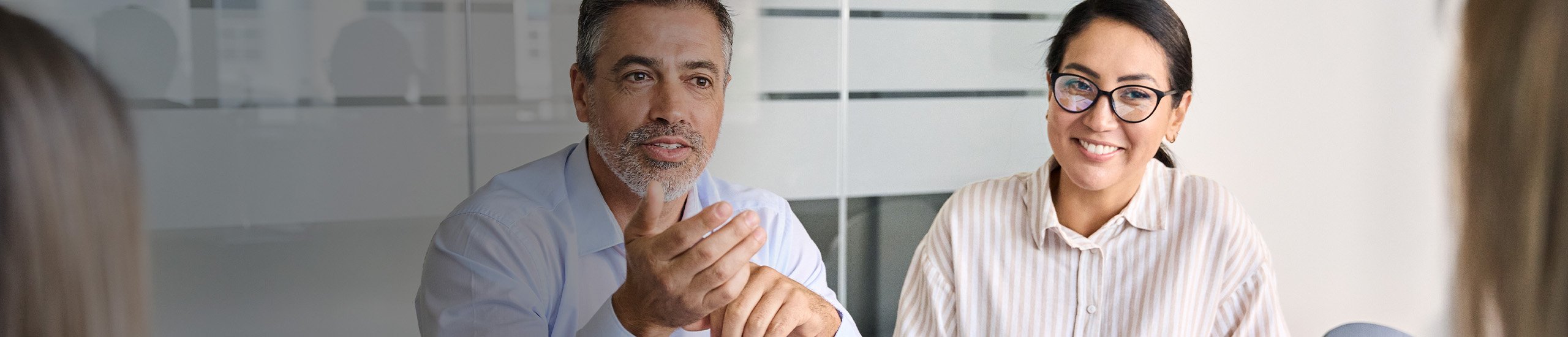 a man holding his hand up to his face