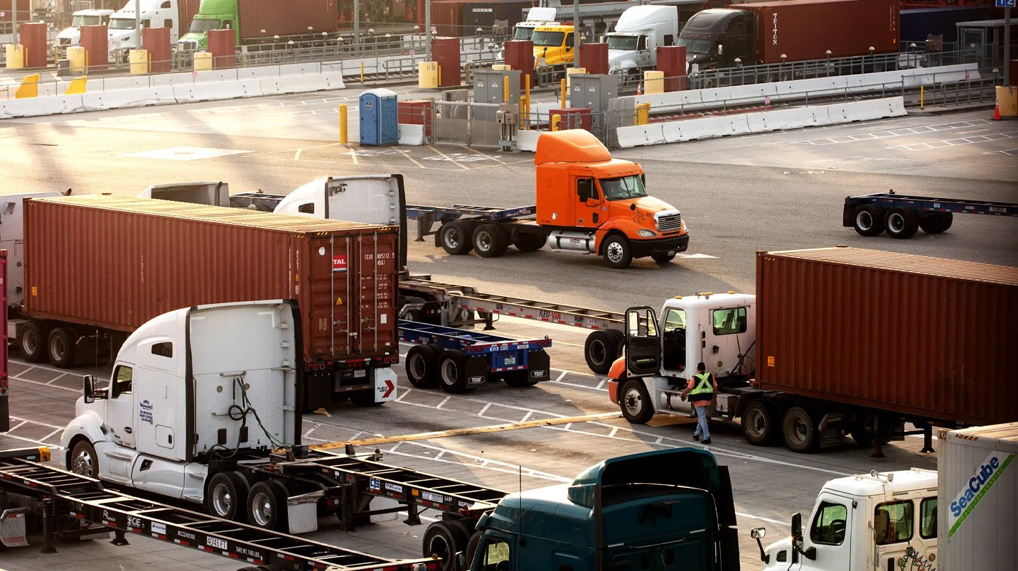 a truck with a trailer in a parking lot