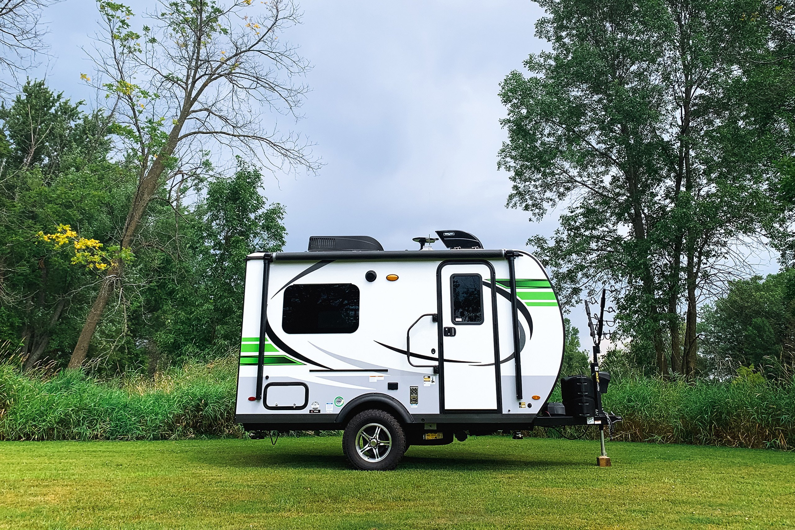 a camper parked in a grassy area