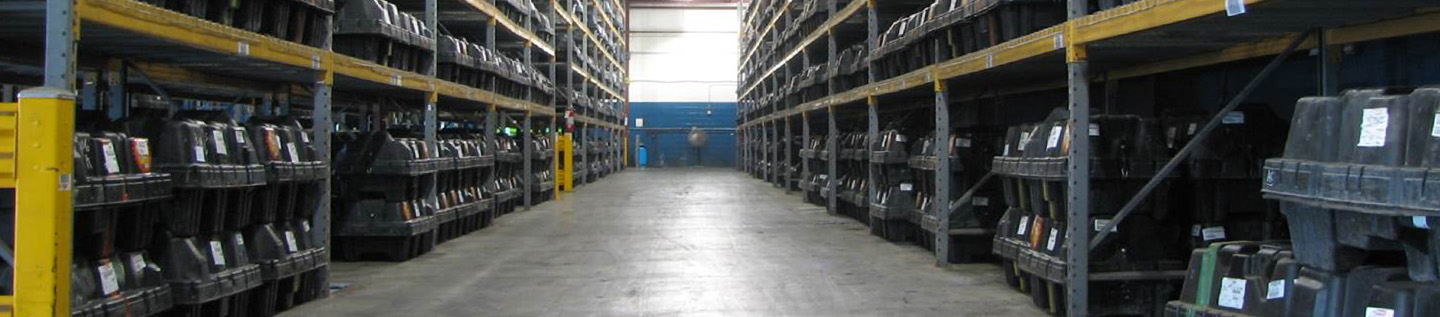 a warehouse with shelves and a blue wall