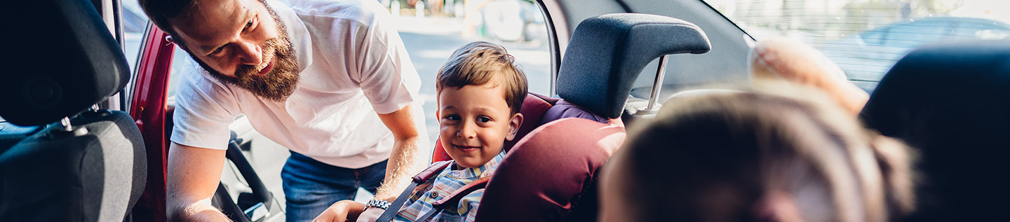 a child in a car seat