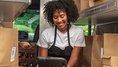 a woman in a black apron