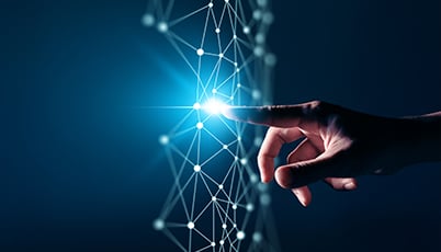 a finger pointing at a glowing light