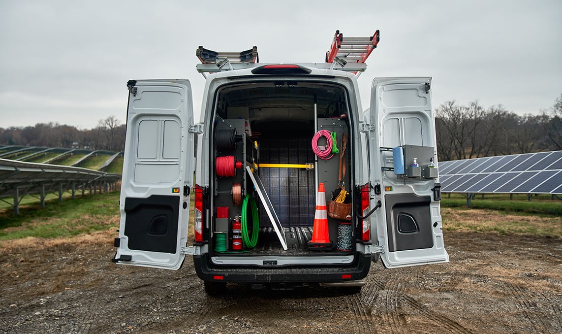The backdoors of an upfitted van open