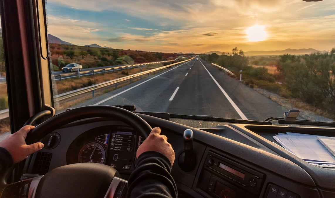 a person driving a car on a road