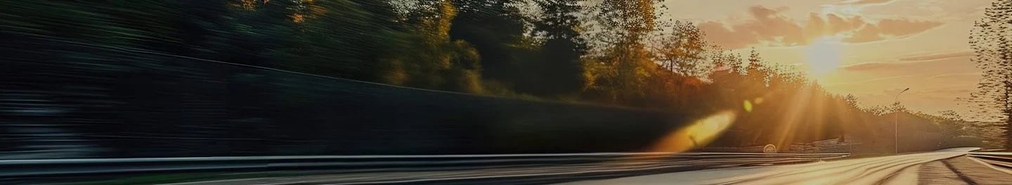a blurry image of a car driving on a road