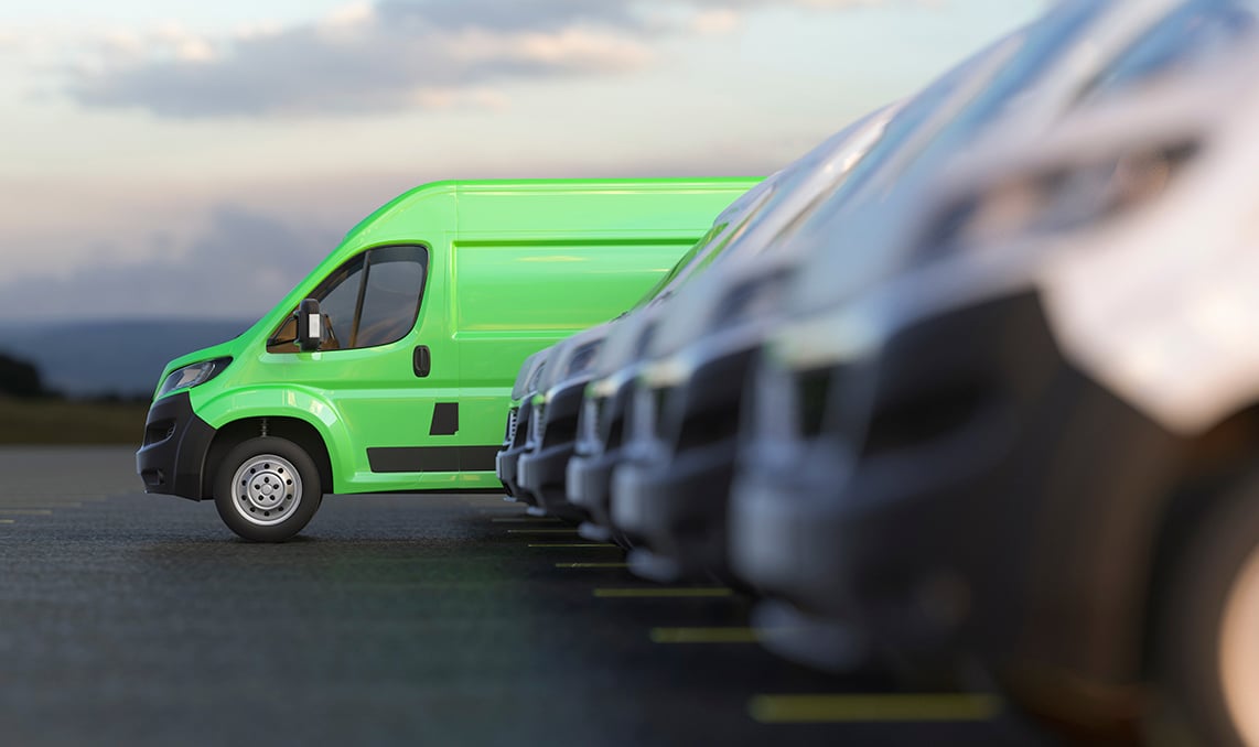 A green light-duty van