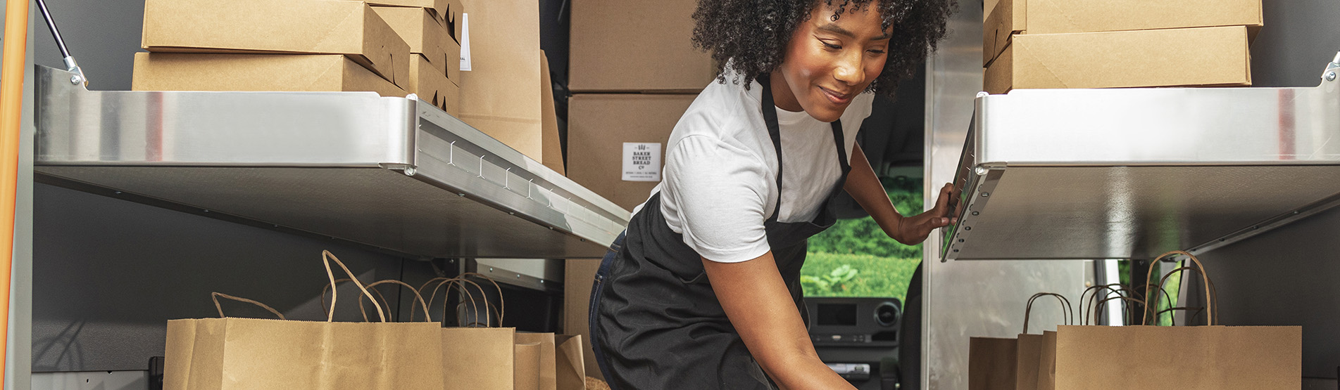a woman in a black apron
