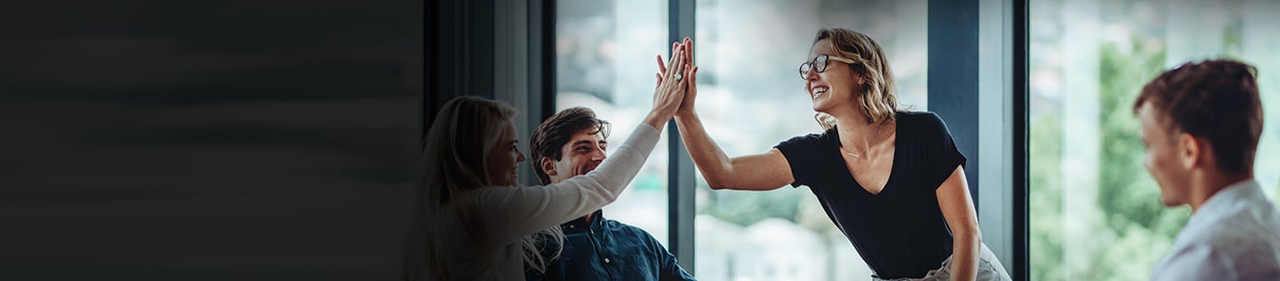 a group of people giving each other a high five