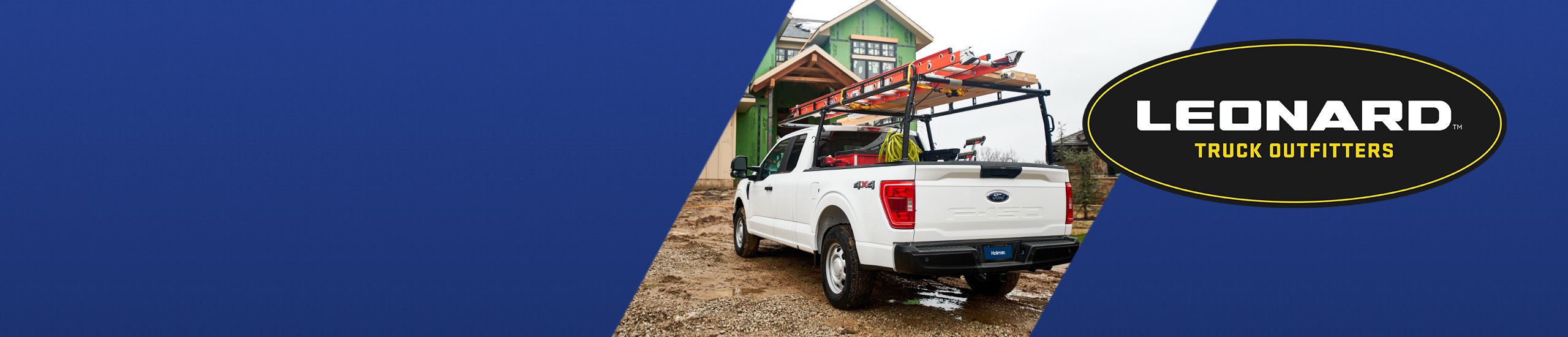 White work truck outfitted with tools at a residential construction site.