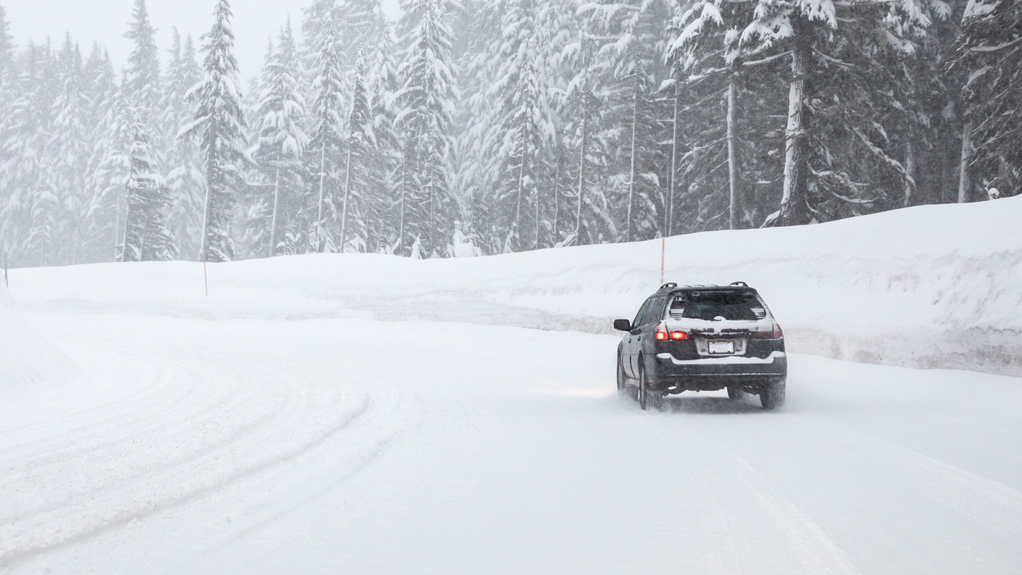 a car driving through the snow