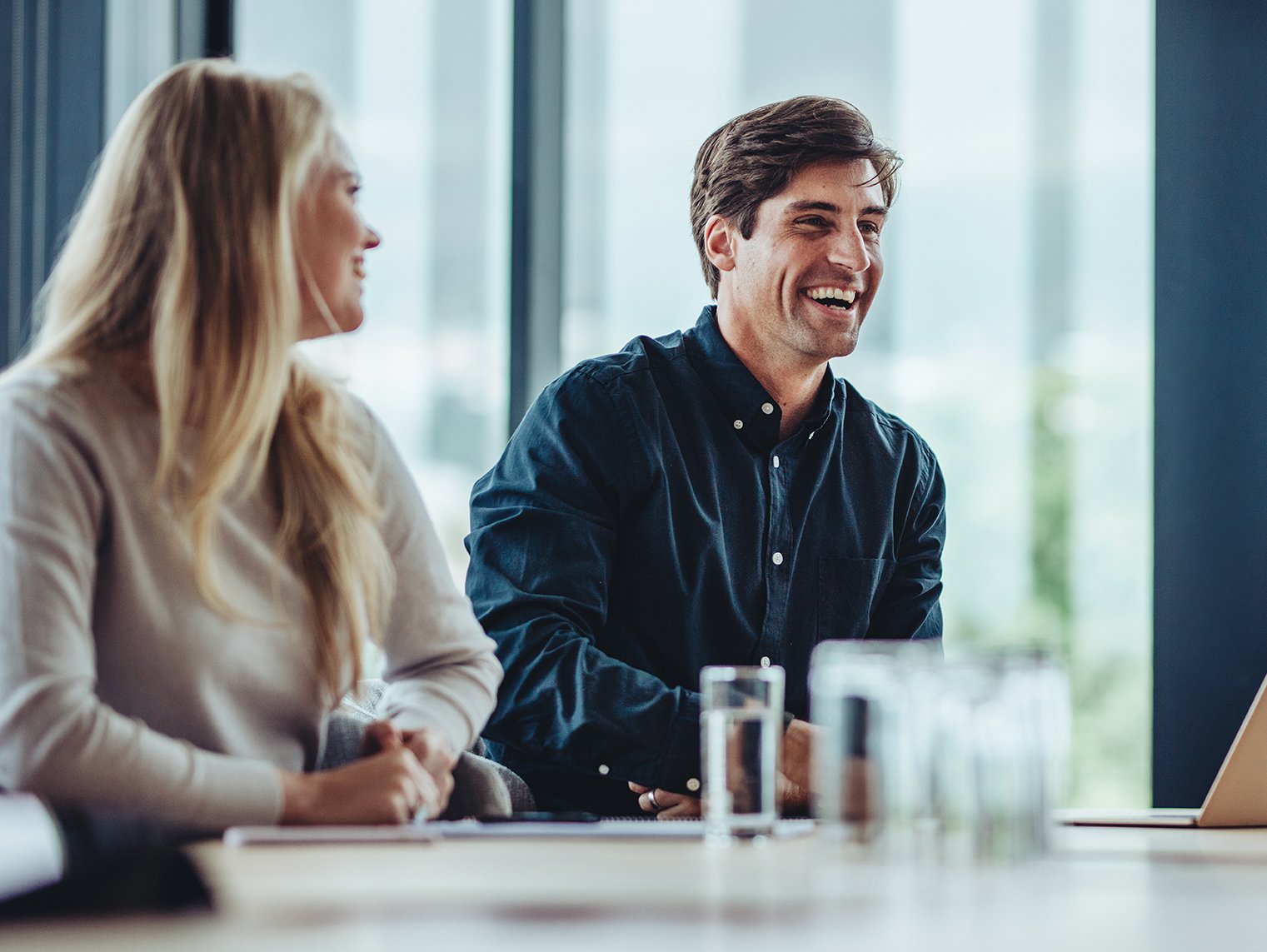 a man and woman sitting at a table