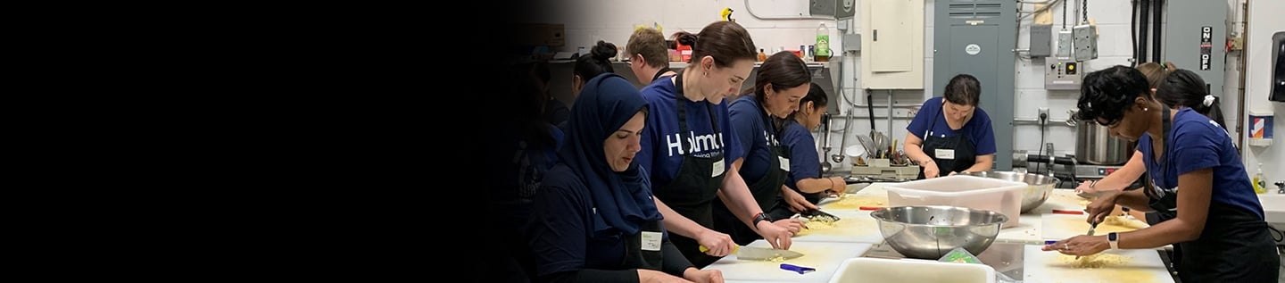 a group of women working around a table