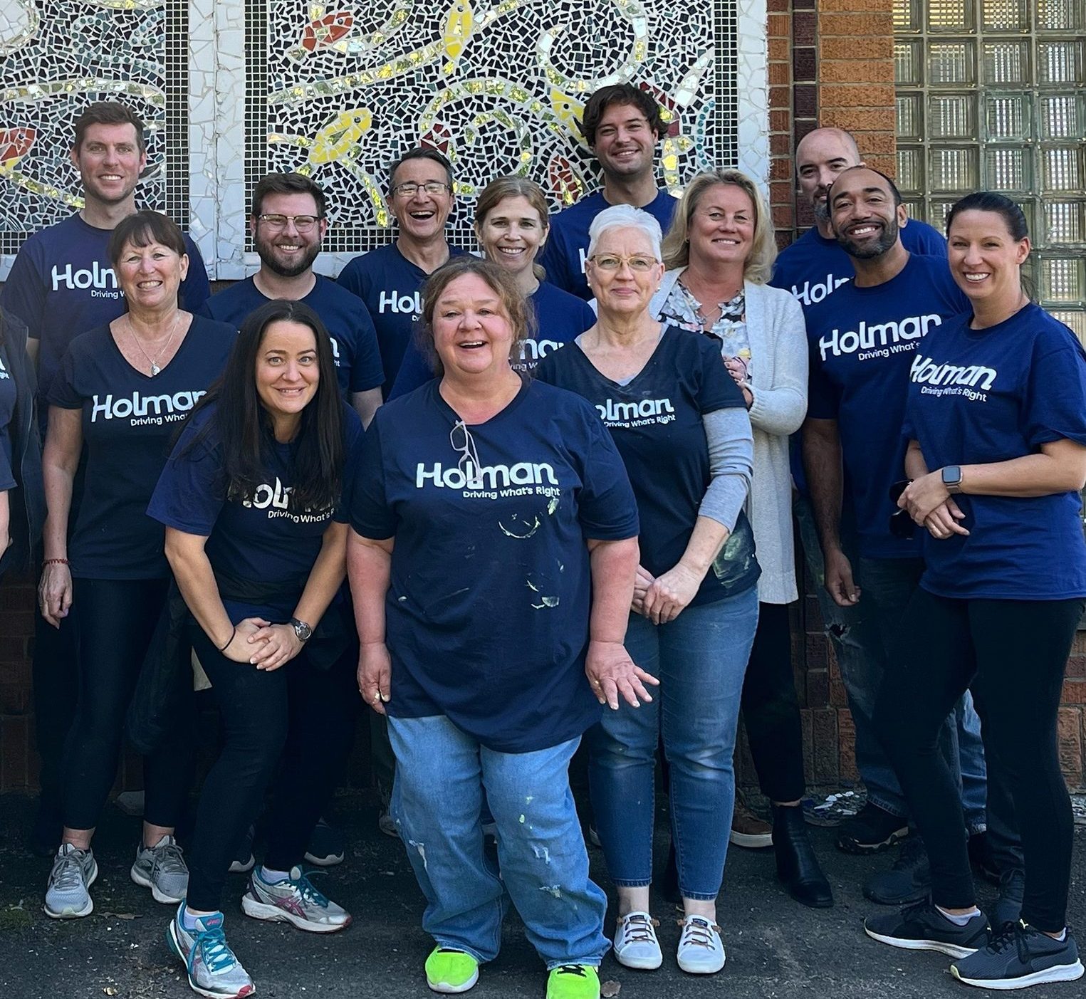 a group of Holman employees posing for a photo