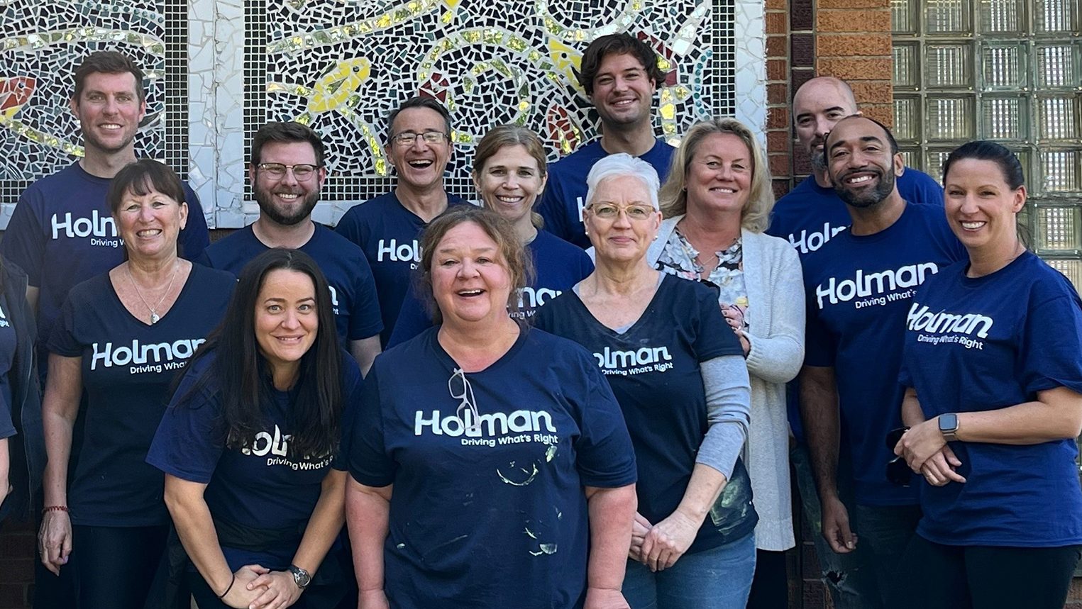 a group of Holman employees posing for a photo