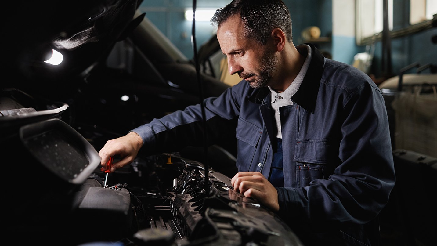 a man working on a car