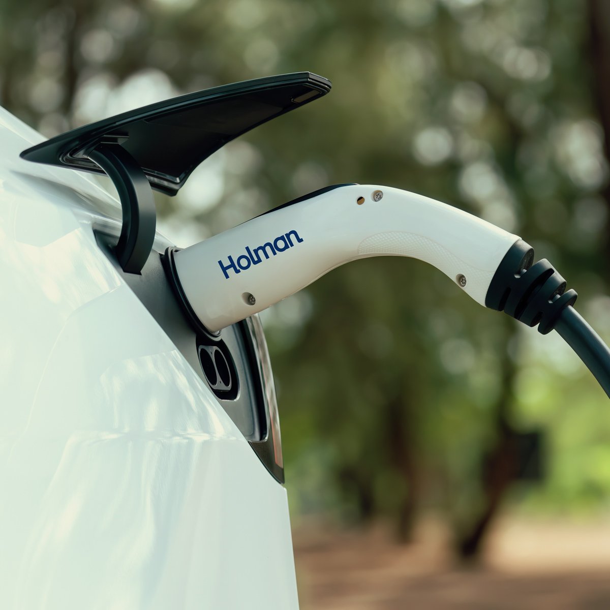 a white car parked and charging