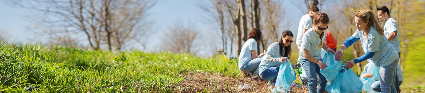 a couple of people sitting on the grass