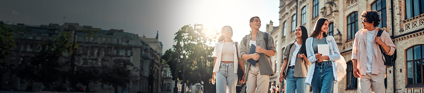a group of students walking on campus