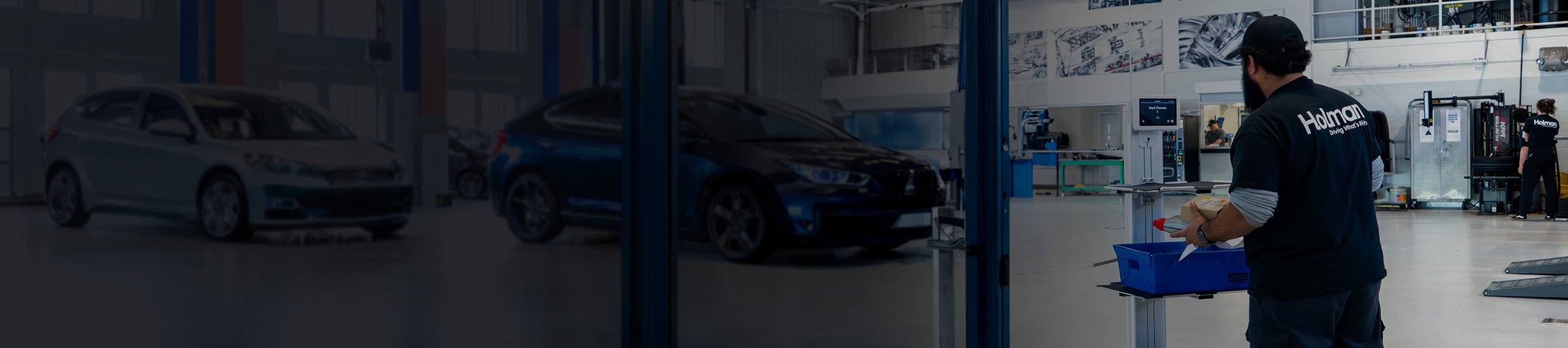 Automotive workshop with technician and cars