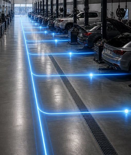 Automotive workshop with illuminated pathways.