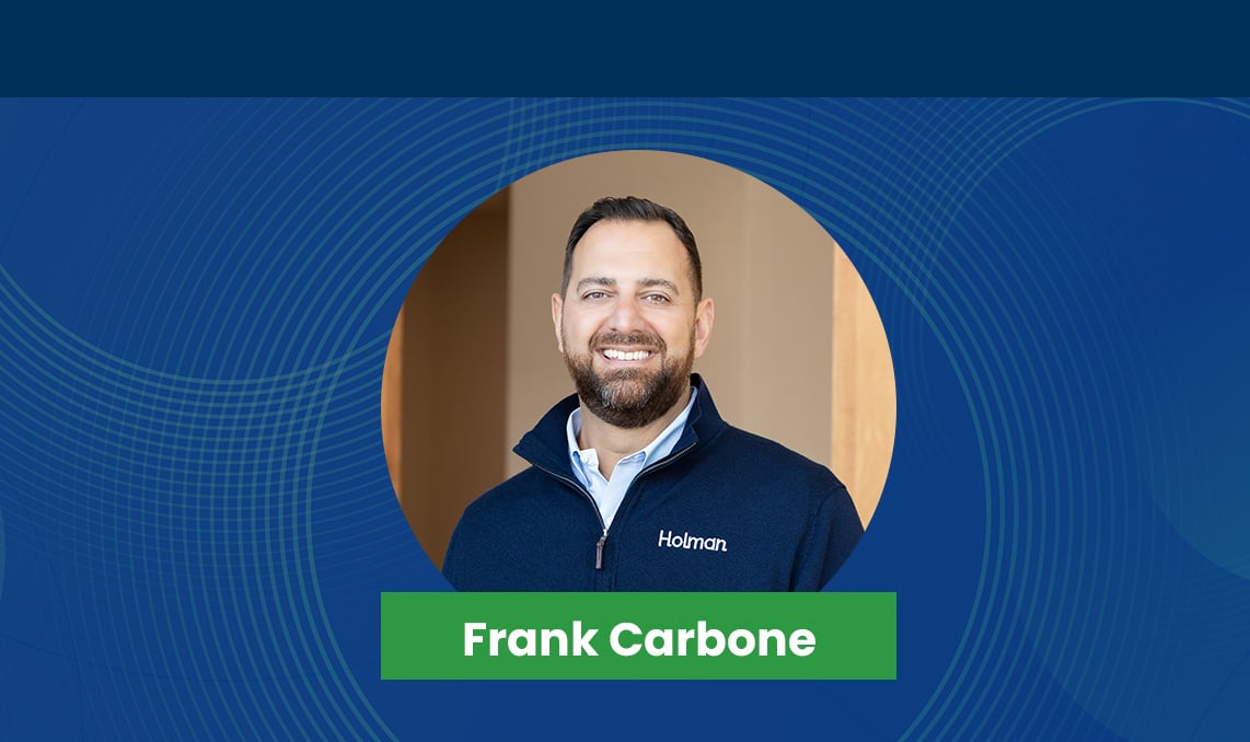frank carbone smiling in professional attire.