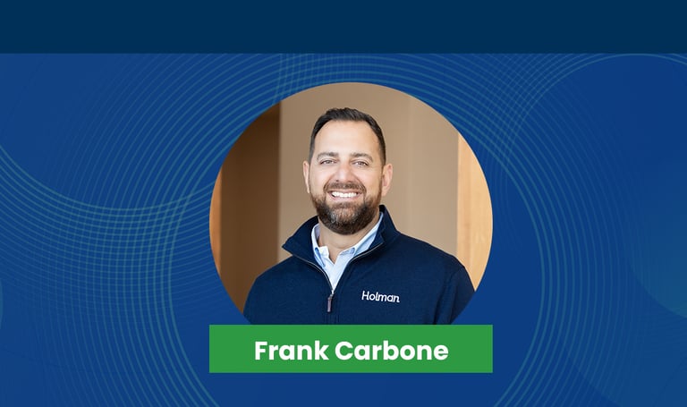 frank carbone smiling in professional attire.