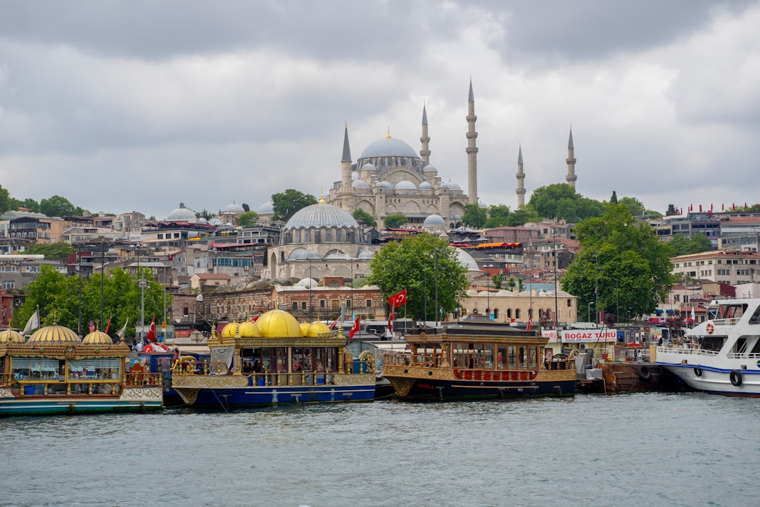 Bosphorus Strait with a ferry passing by and historical buildings on the shore