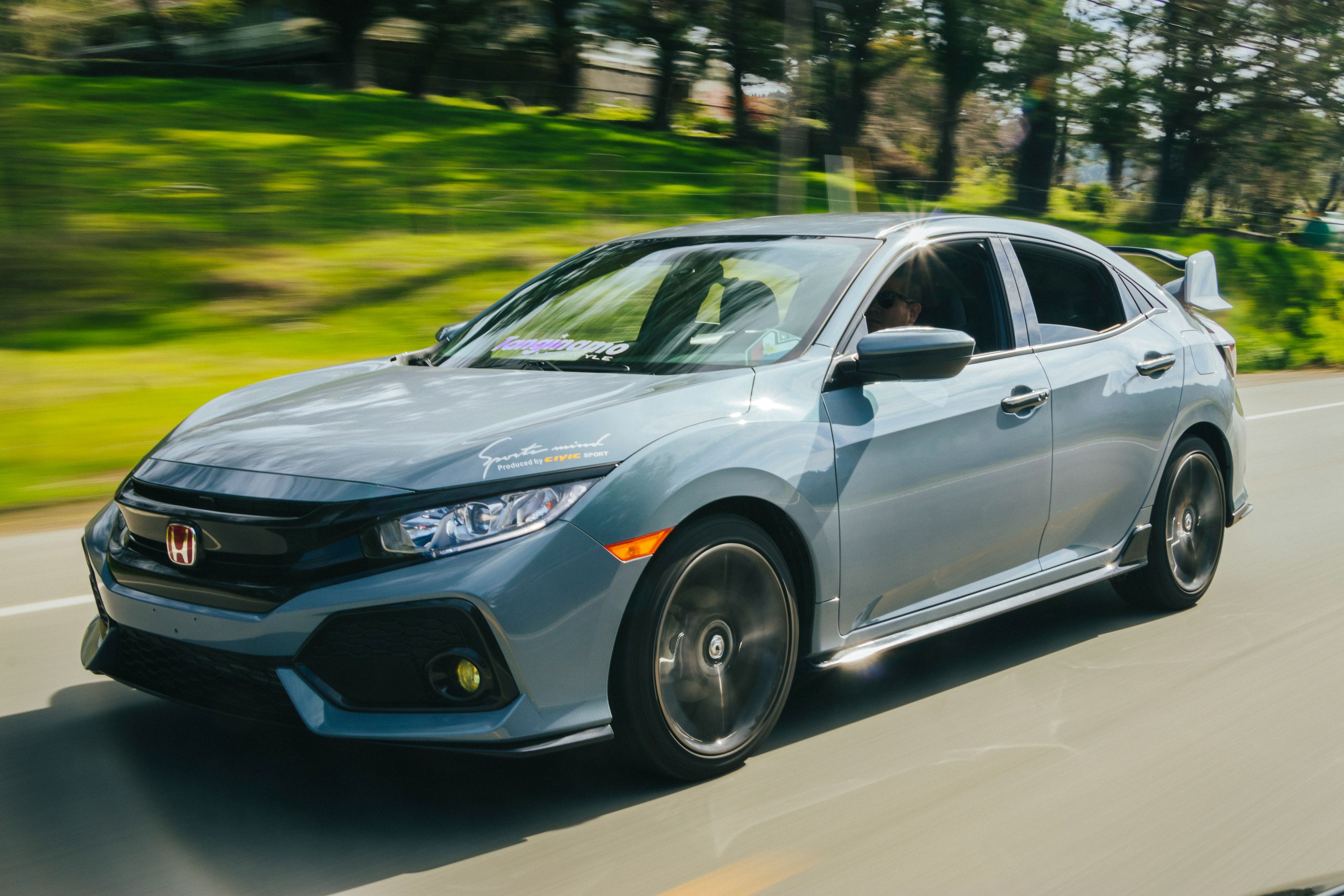 Grey Honda Civic Type R photographed in motion with panning blur