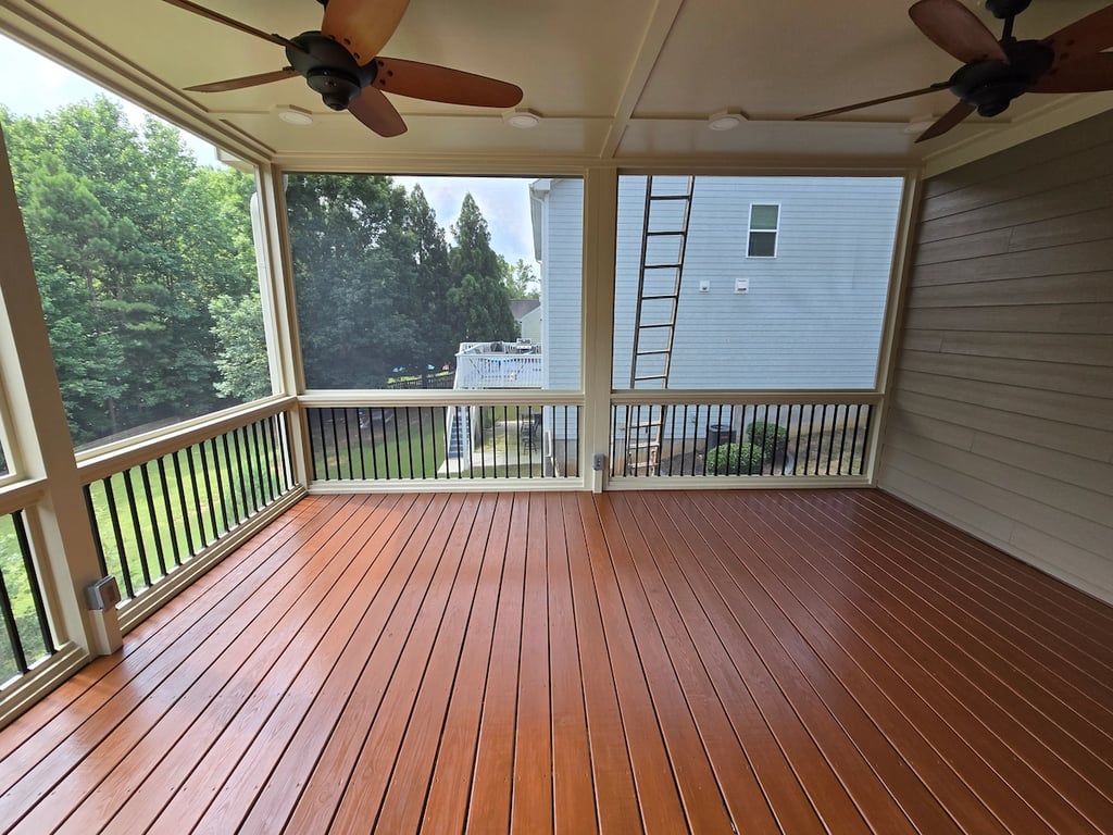 Sherwin-Williams Super Deck deck stain applied to a rear enclosed rear porch floor in Apex, NC.