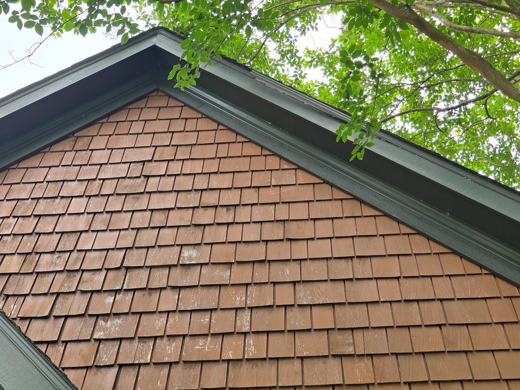 Original technical assessment of weathered cedar shake siding in Youngsville, NC, documenting the diagnostic process used to evaluate wood fiber integrity and pH levels prior to professional restoration.
