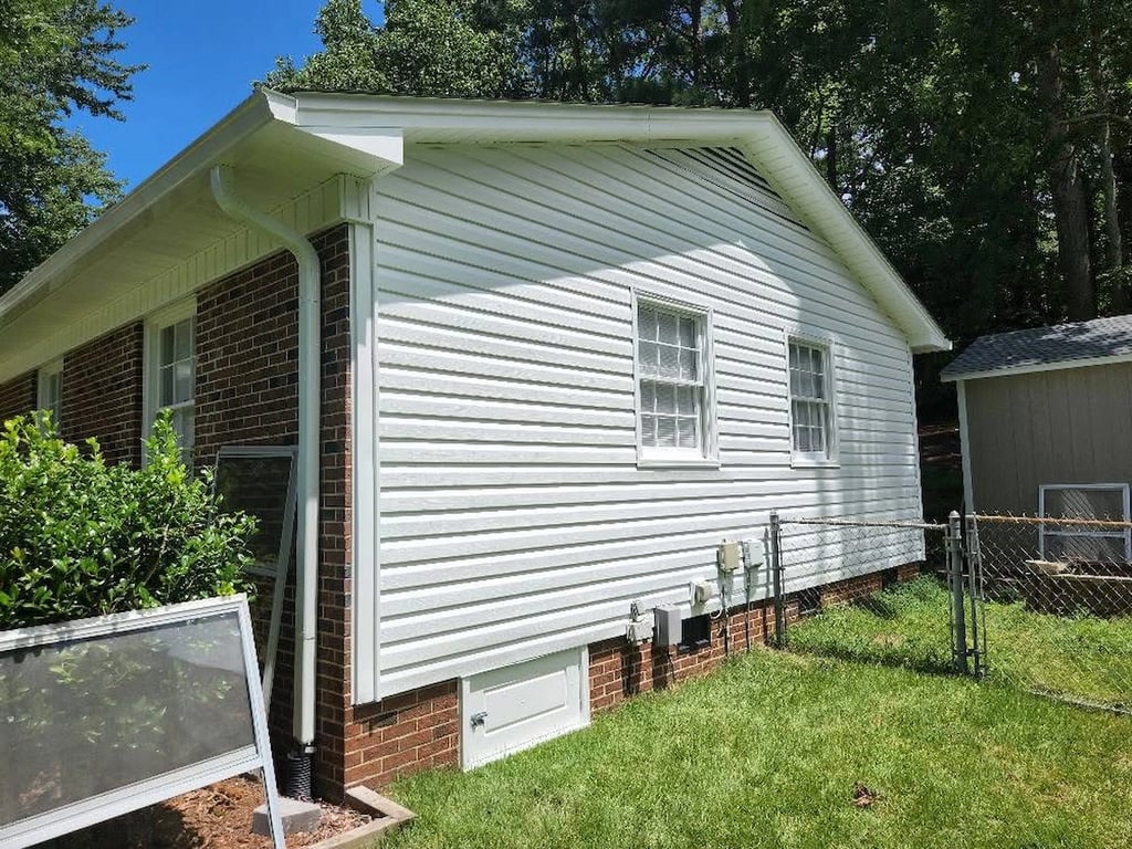 Oxidized vinyl siding on a house.