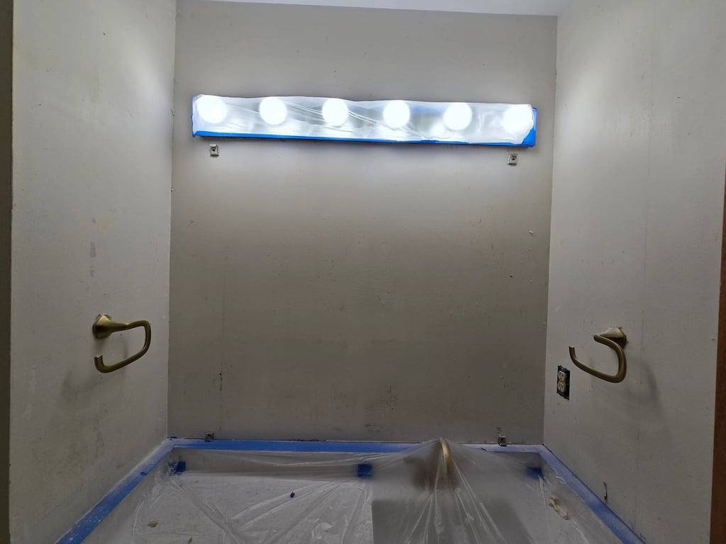 Bathroom wallpaper removal and drywall repair project by A Touch of Color Painting and General Contracting. 