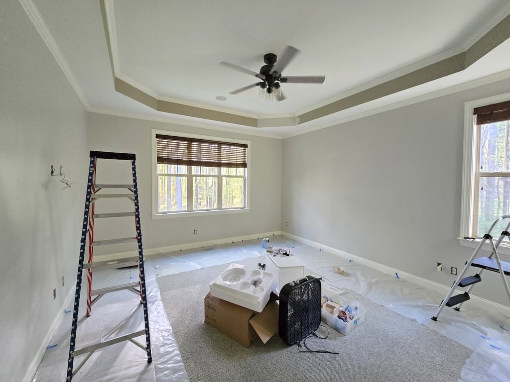 Technical illustration of a master bedroom containment setup on Main Street in Wake Forest, NC, featuring professional plastic perimeters and floor protection used to isolate and prepare smoke-damaged walls.