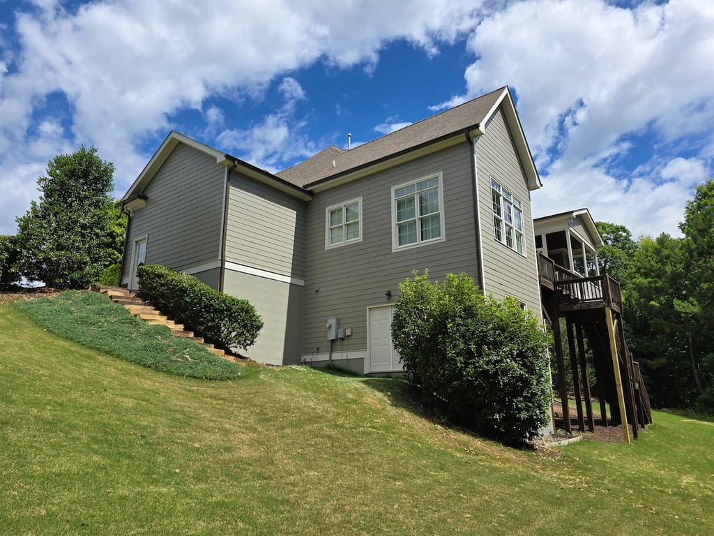 Rear of home in Raleigh NC after painting with premium Sherwin-Williams exterior paints in a satin and gloss finish.