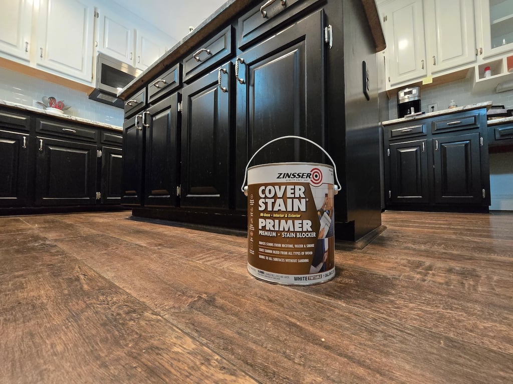 Professional application of Zinsser Cover Stain oil-based primer to interior trim in Cary, NC, to create a high-adhesion bond and seal against wood tannins on a residential project near Green Level Road.