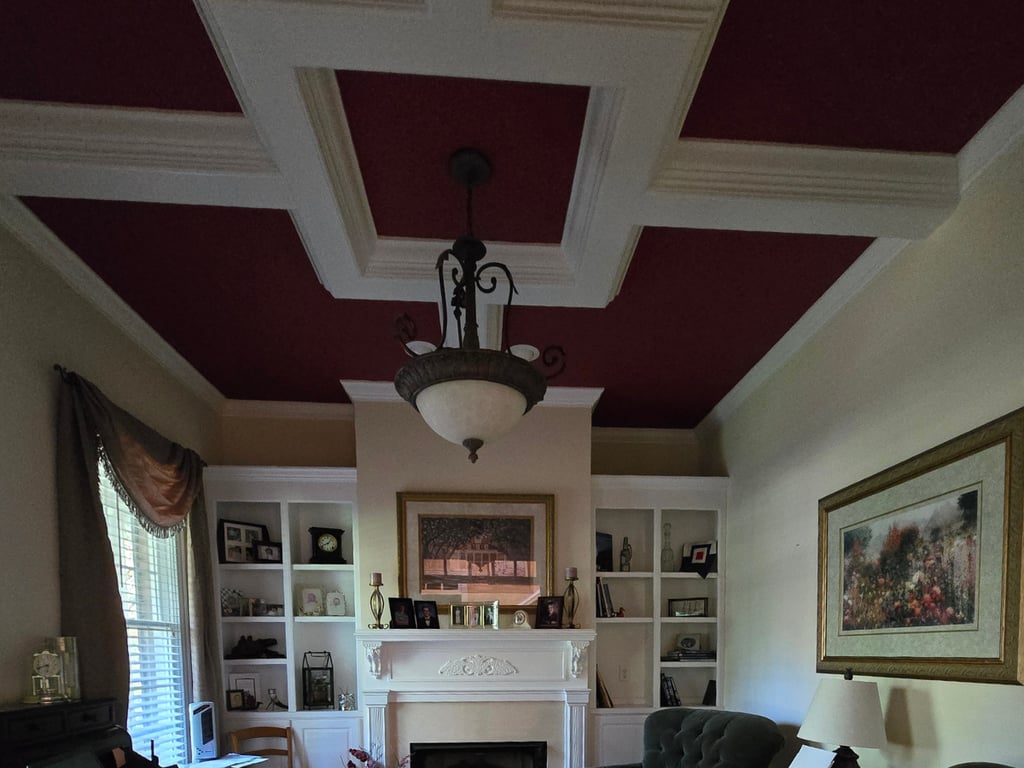 Red textured ceiling in living room. 