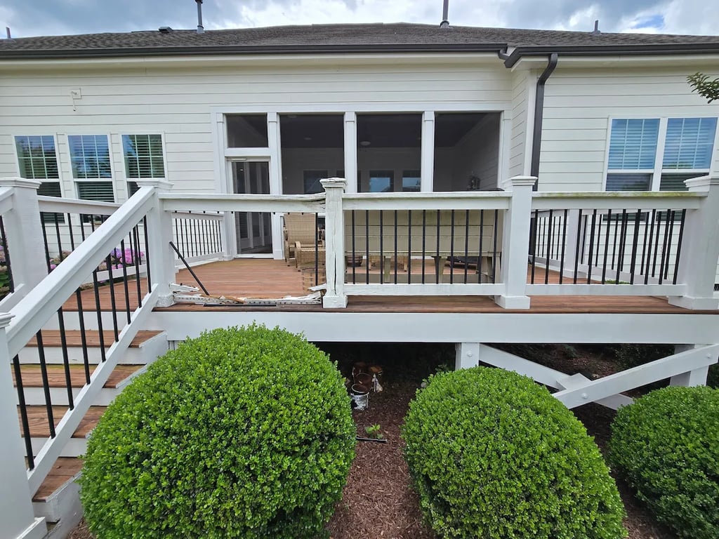 
A detailed view of pressure-treated handrail failure on a deck on Whispering Hills Court in Cary, NC. Documented moisture-related degradation assessed by A Touch of Color.