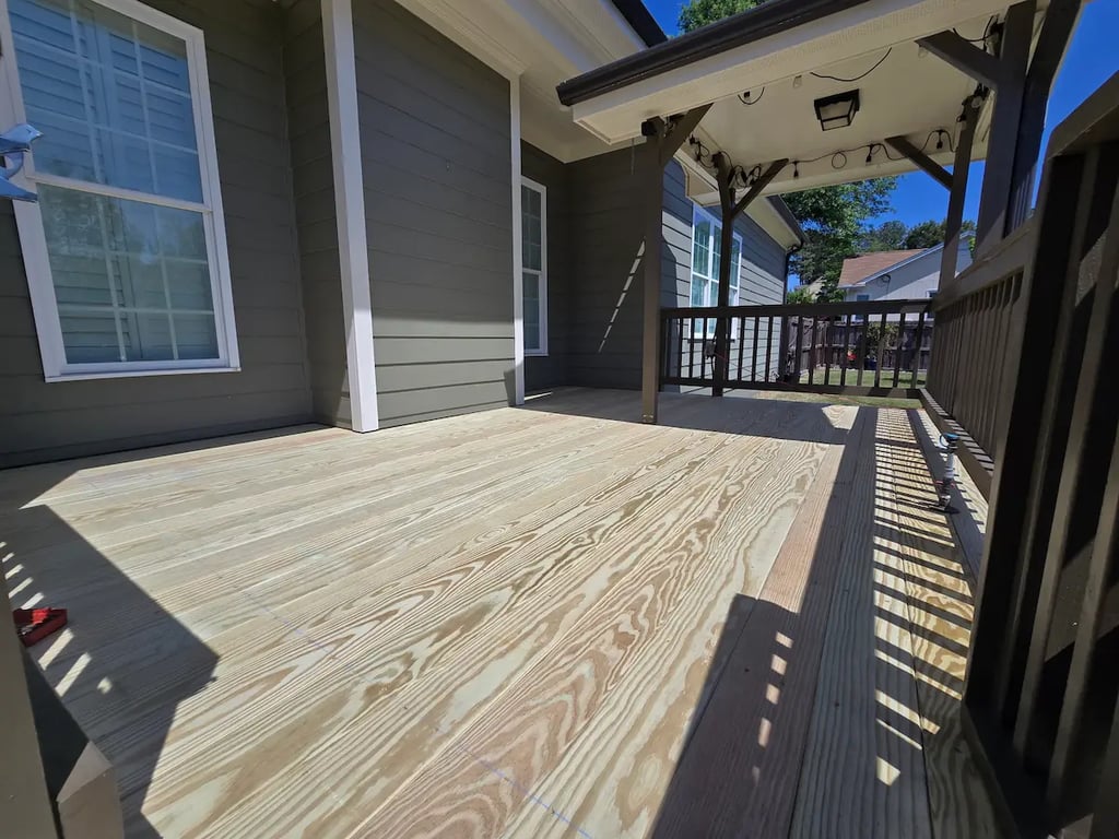 Technical detail of a blemish-free C and Better premium deck floor on Howard Road in Raleigh, professionally installed by A Touch of Color Painting & General Contracting.