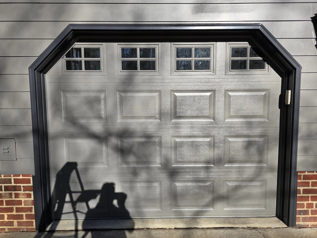 Sherwin-Williams Iron Ore painted around the casing of a garage door in Raleigh.