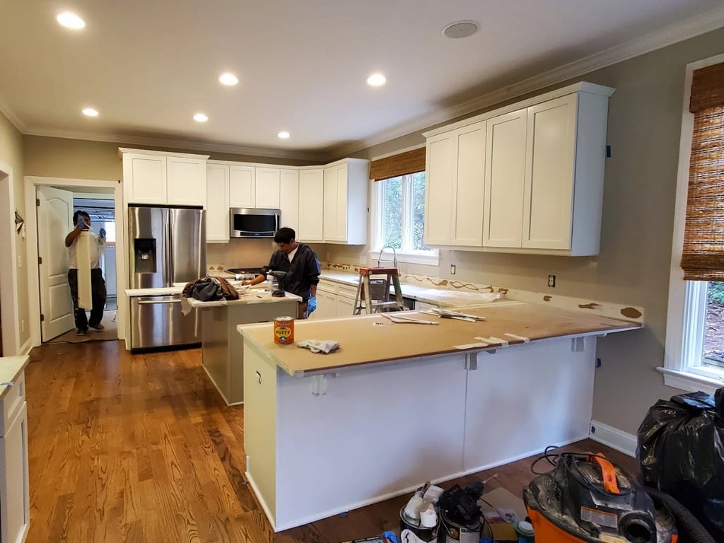 Image of A Touch of Color Painting renovating a kitchen with new cabinet painting
