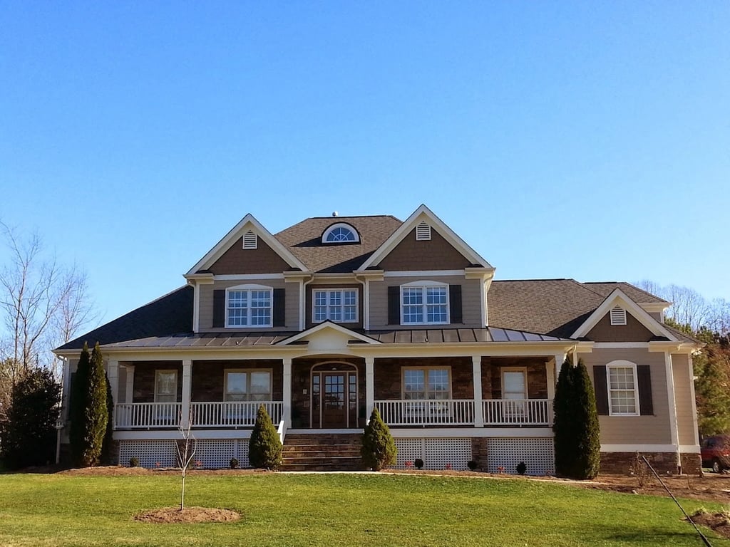 Home in Wake Forest, NC with Black Fox shutters and dark brown accents.