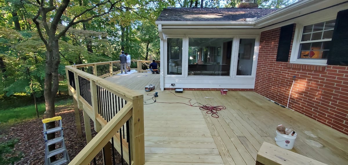 Professional custom deck on Wildwood St in the Brookhaven neighborhood of Raleigh, NC, featuring high-quality Madison treated lumber and precision-finished handrails to ensure long-term durability against NC humidity.