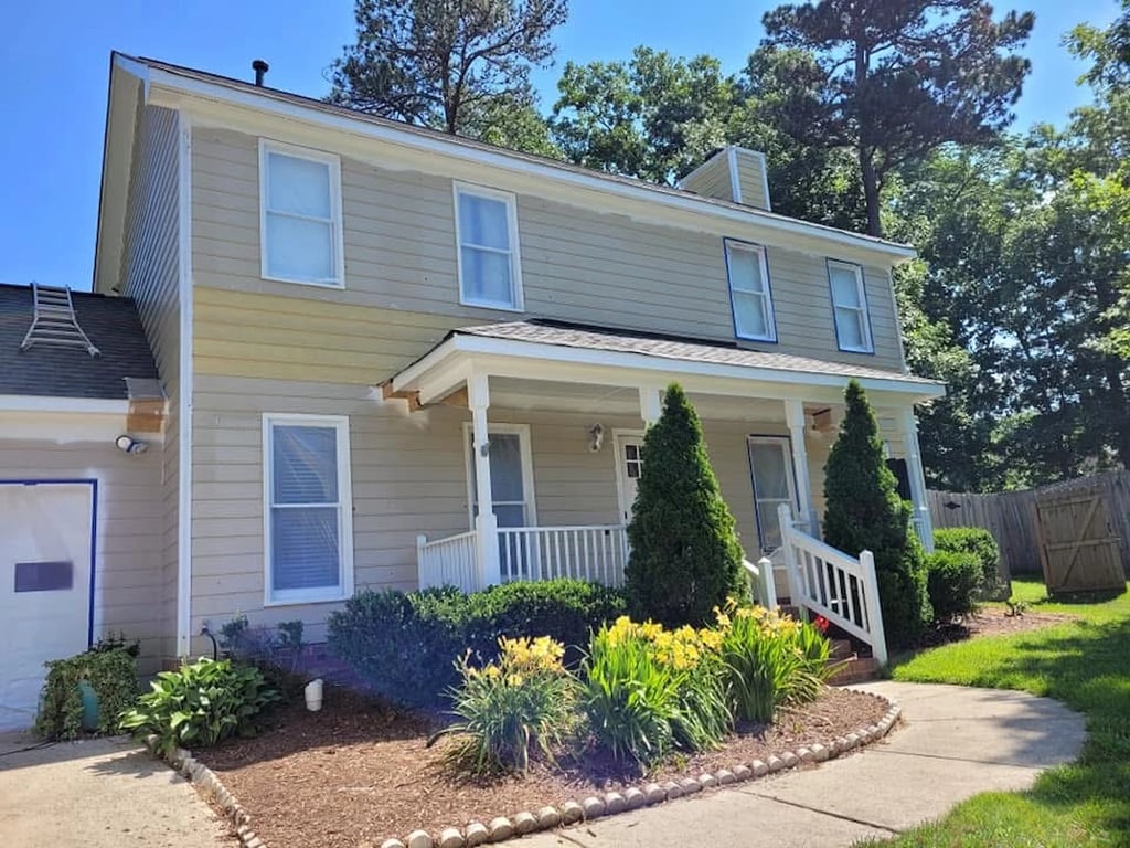 Before image of an exterior house painting and repair project on Laurel Branch Drive in Cary, NC, showcasing the diagnostic phase used to determine accurate pricing and repair needs in the Brookgreen Forest neighborhood.