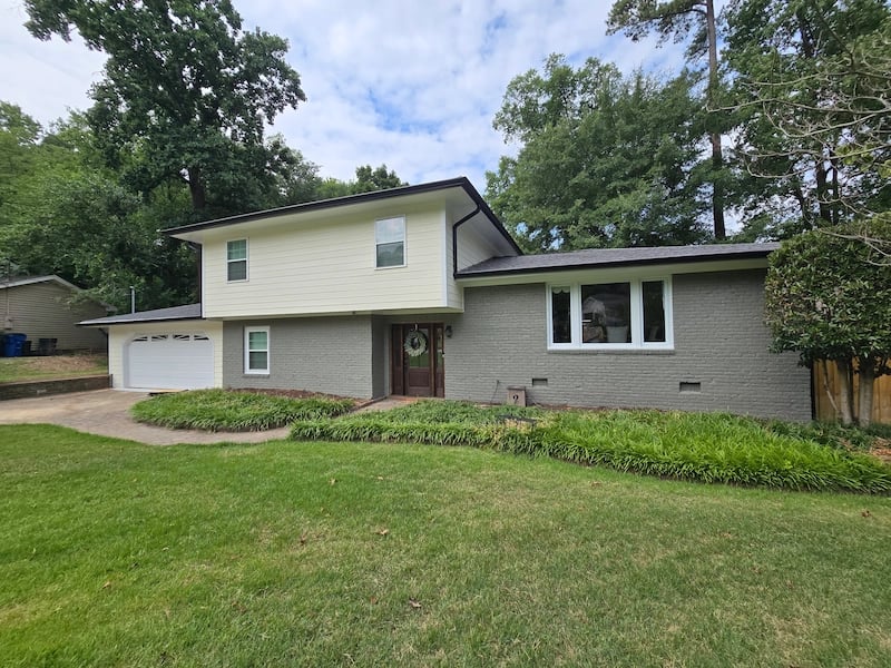 A meticulously clean yard and protected landscaping after a professional house painting project, demonstrating our commitment to a zero-trace cleanup and total property protection for Triangle homeowners.