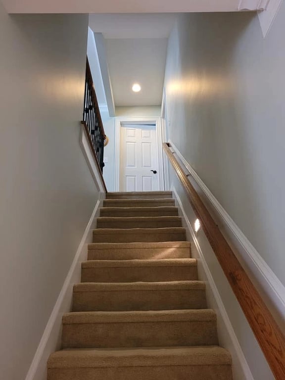 Finished walls applying Cashmere eggshell to drywall in a stairwell.