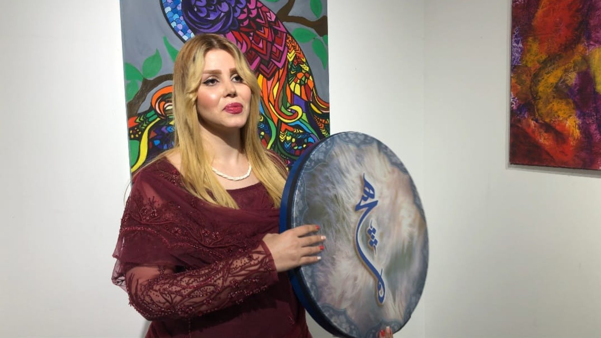 Video Meet Jina Khulqi as she plays the daf at a womens art exhibition