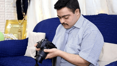 Kut man overcomes challenges with Down Syndrome through photography
