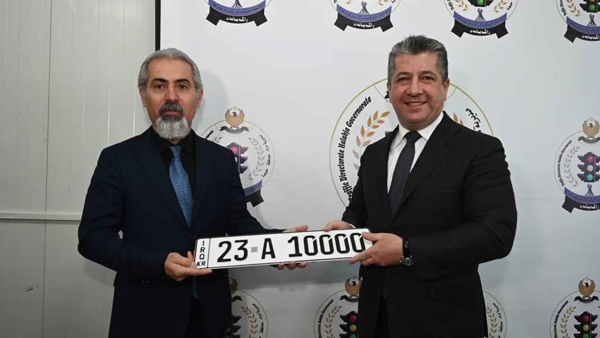Halabja survivor receives first car license plate by KRG PM Barzani